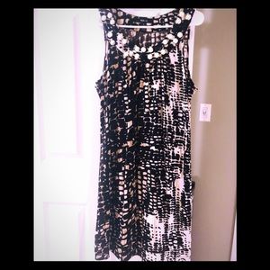 Sleeveless tunic with embellished neckline